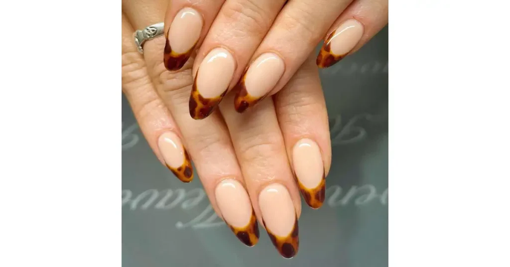 10. Brown tortoiseshell French tip nails