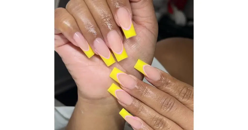 12. Yellow acrylic French tip nails