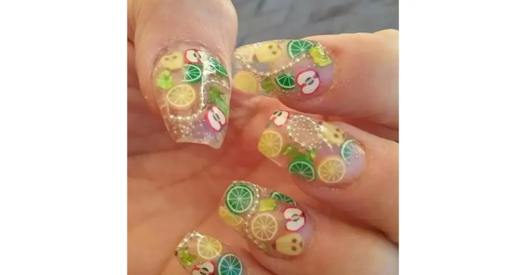 41. Glitter ombre acrylic nails with tiny painted nail designs