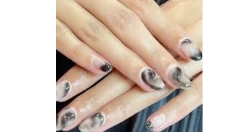 33. Classy smokey acrylic nails with 3D details