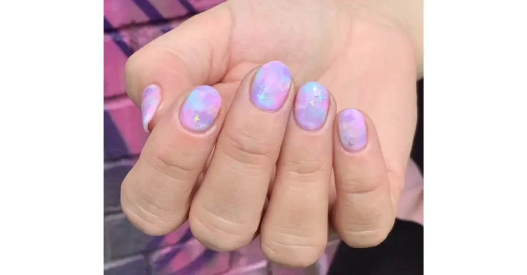 31. Baby pink and blue chrome acrylic nails with stencil designs