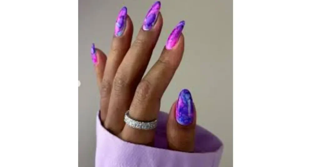 15. Purple, pink, and blue inky acrylic nails