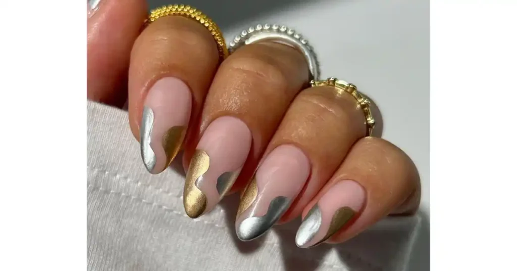 26. Silver liquid metal chrome nails with pastel flowers