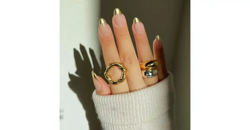 28. Gold chrome acrylic French tip nails 