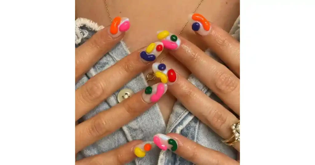 29. French tip acrylic nails with 3D dot designs