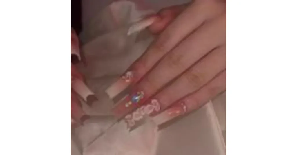 61. Long square nude acrylic nails with gems