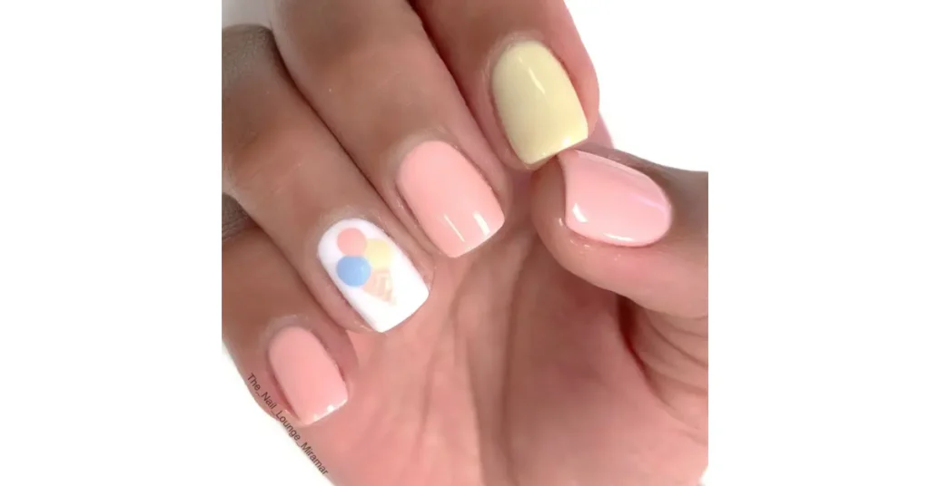 63. Round ice cream pastel nails with feature nail design