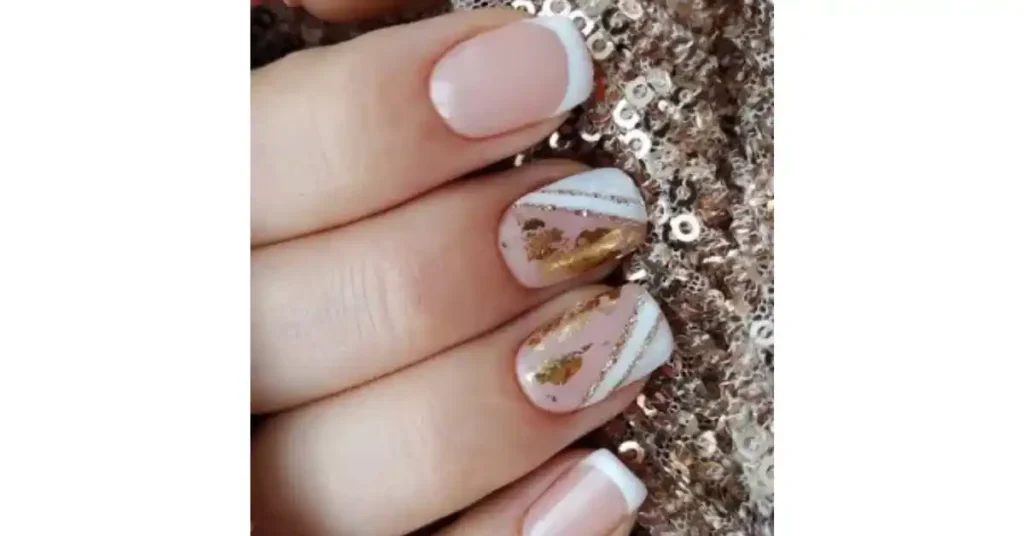 70. Neutral shades fall acrylic nails with gold details