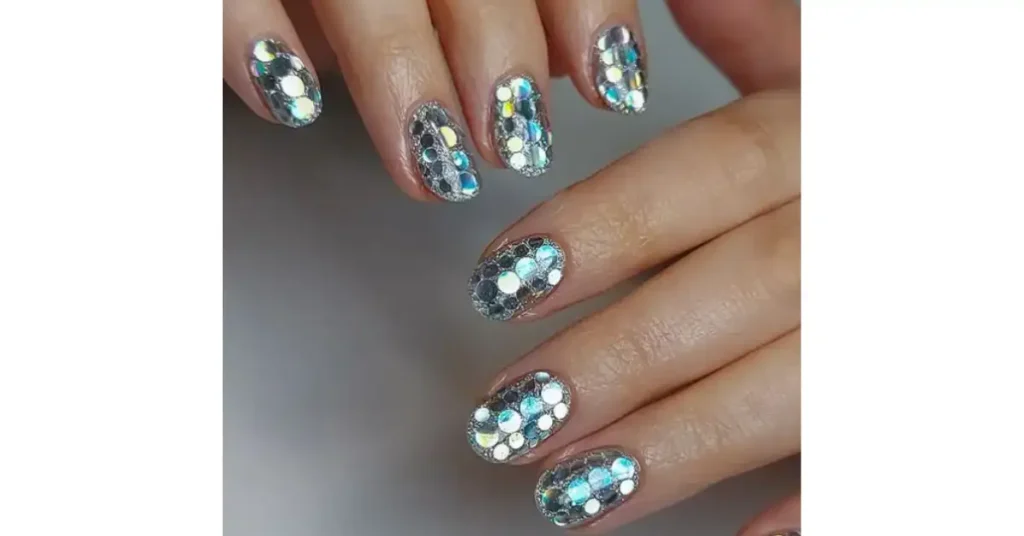 75. Disco ball silver glittery New Year’s Eve acrylic nails