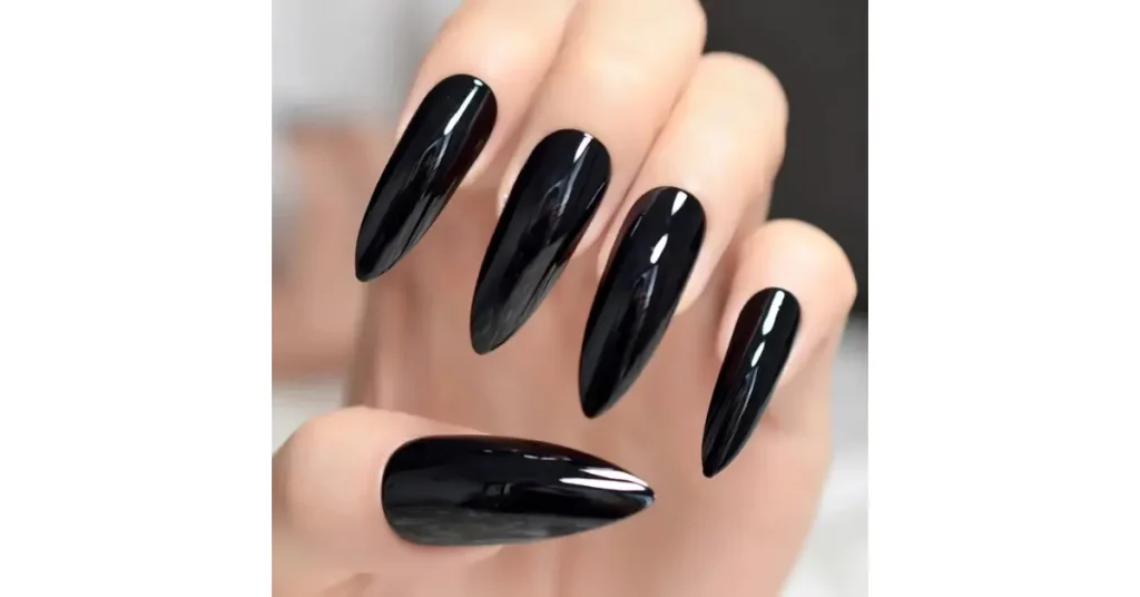 76. Jet black acrylic nails